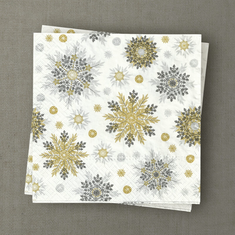 Apportez éclat et raffinement à vos tables de fêtes avec nos serviettes en papier imprimées de flocons de neige dorés, argentés et noirs.